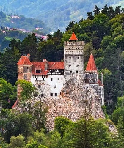 Bran Castle on its rock, seen from the road below